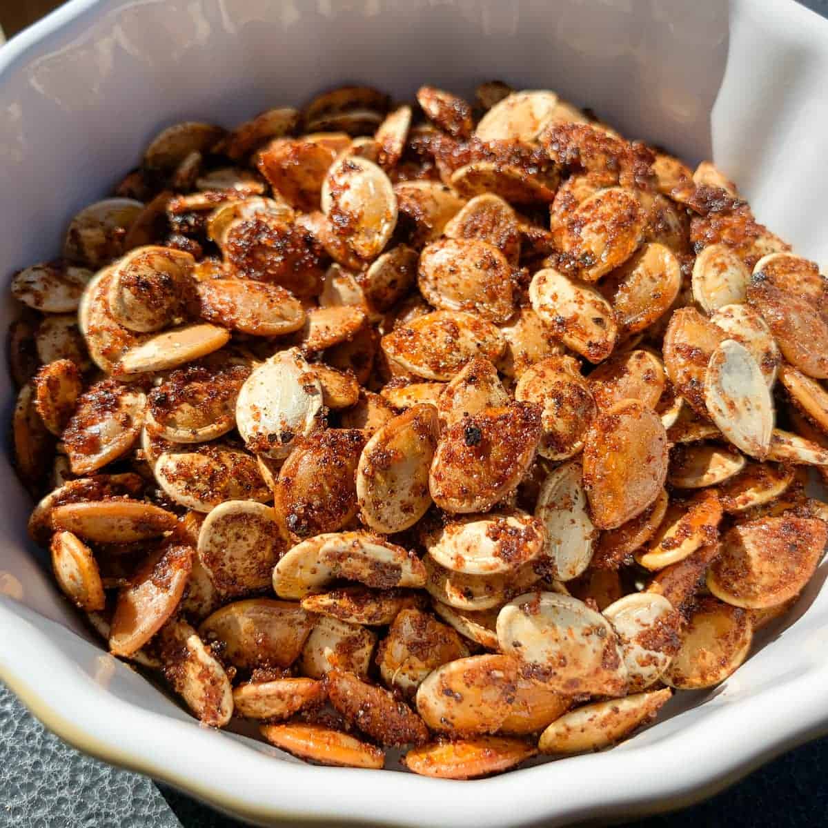 smoked pumpkin seeds in a small round dish