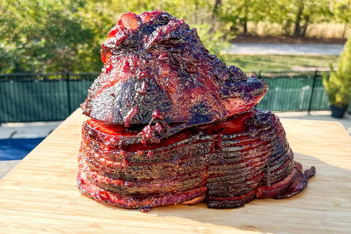 cherry glazed twice smoked ham on a cutting board