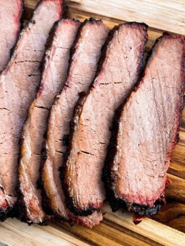 slices of smoked beef brisket on a cutting board