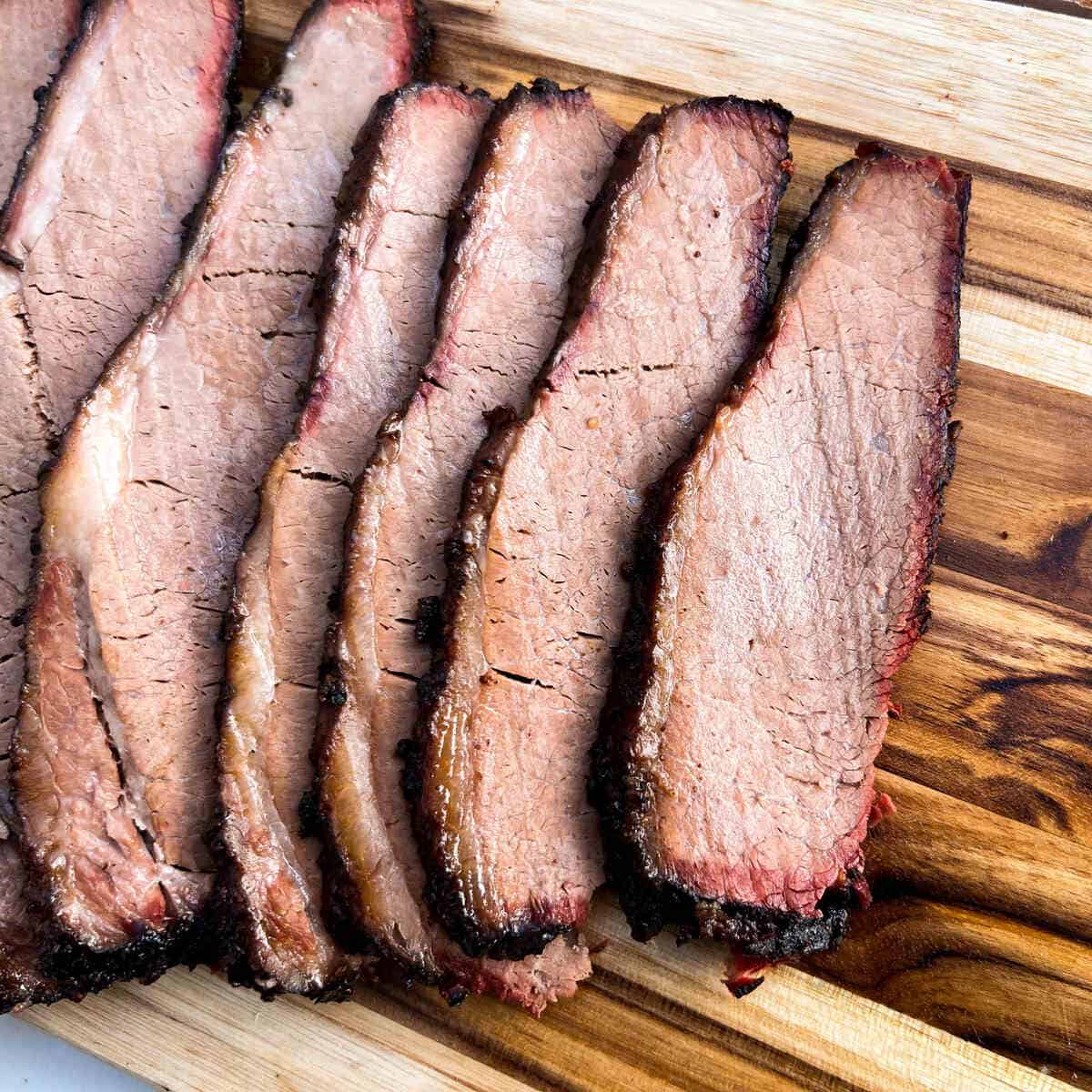 slices of smoked beef brisket on a cutting board