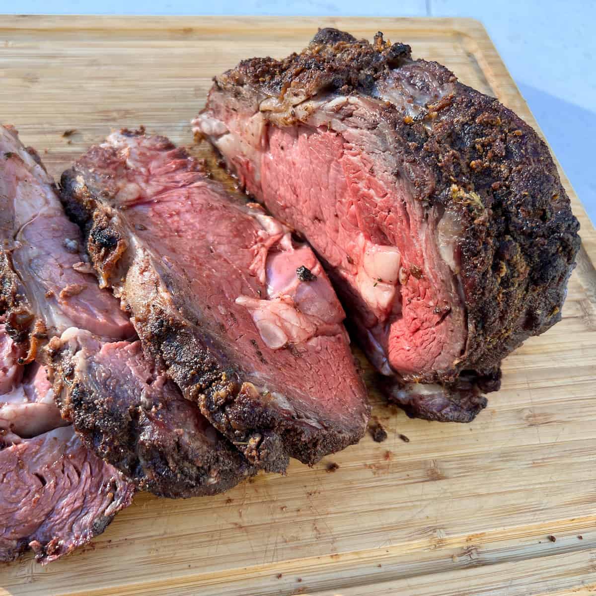 a sliced smoked ribeye roast