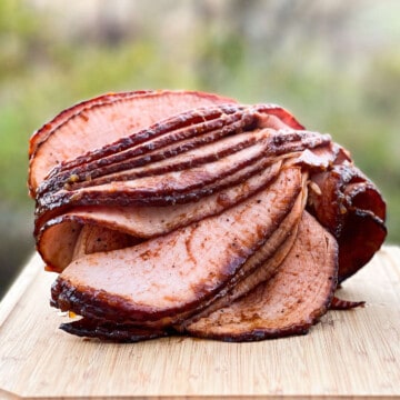 double smoked bone-in half ham on a cutting board