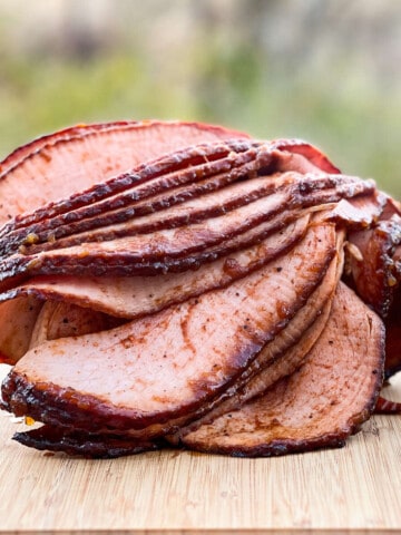 double smoked bone-in half ham on a cutting board