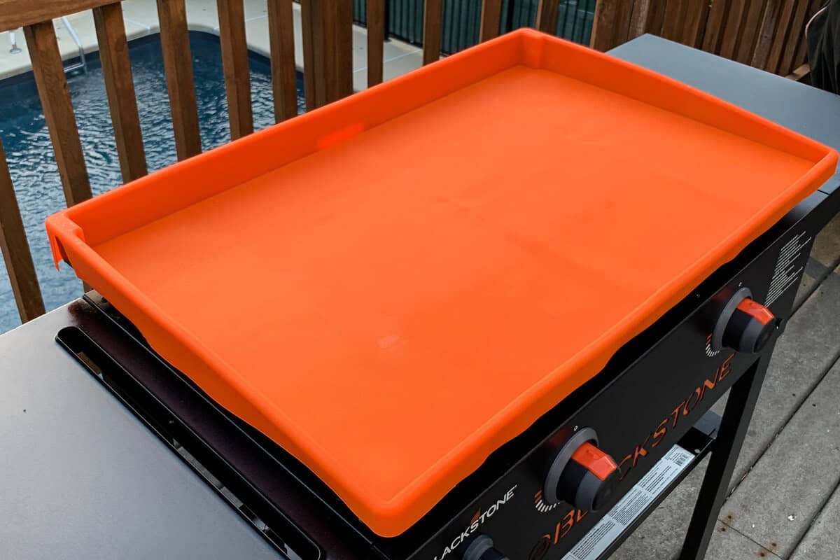 a silicone mat placed over the cooktop of a Blackstone griddle