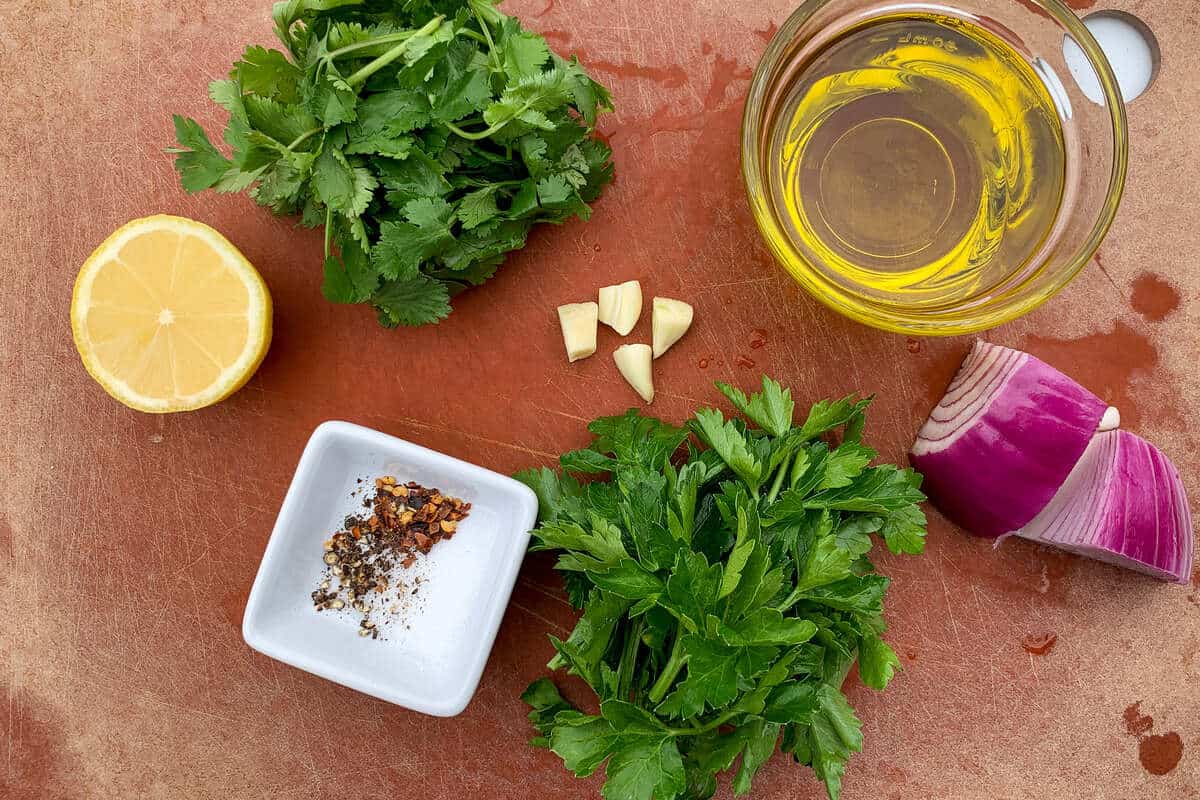 chimichurri ingredients on a cutting board