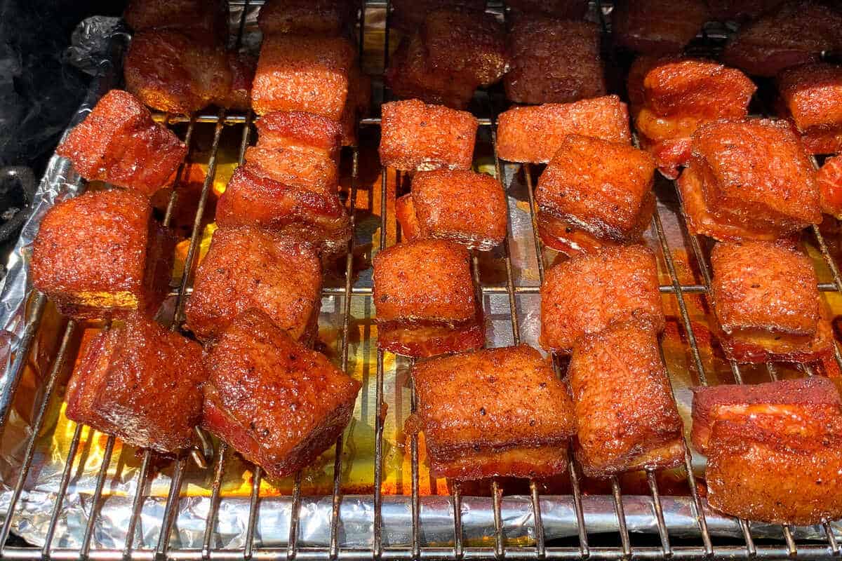 a tray of seasoned pork belly cubes during the bark forming step