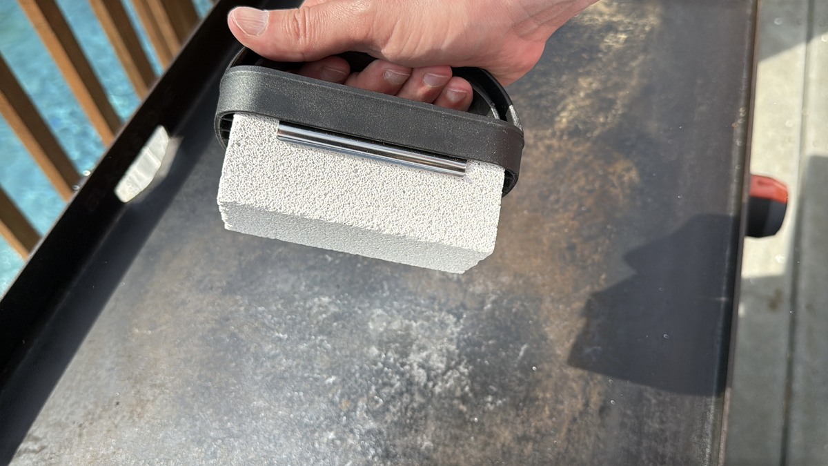a handled pumice stone cleaner for deep cleaning a Blackstone griddle