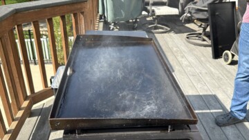 smoke coming off the surface of a Blackstone griddle