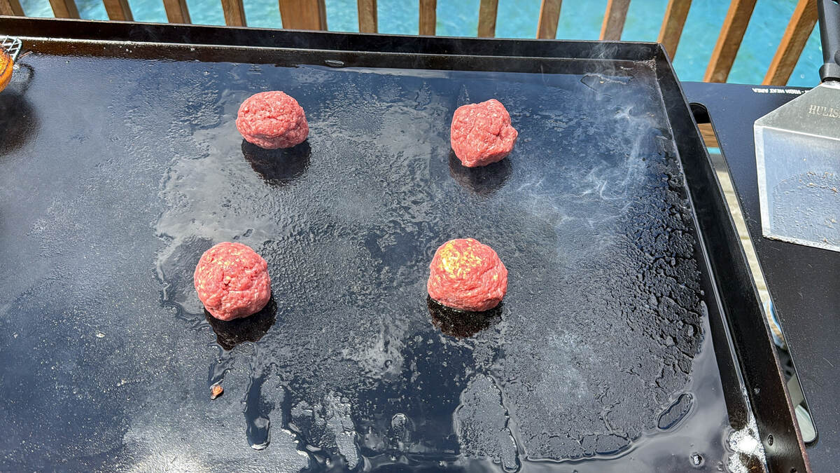 balls of meat on a Blackstone griddle